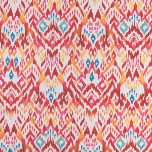 Tela ikat Menorca rojo es un algodón estampado en tonos rojos, naranjas y azules